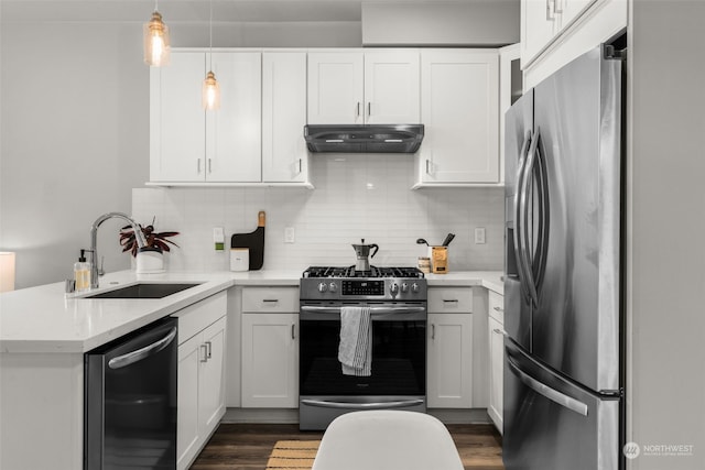 kitchen featuring appliances with stainless steel finishes, white cabinets, and sink