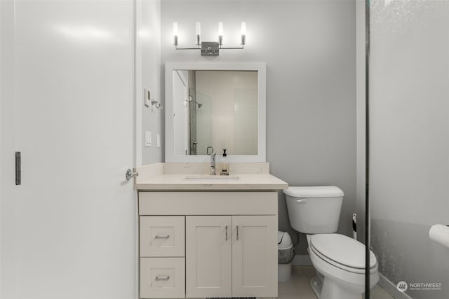 bathroom with toilet, vanity, an enclosed shower, and tile patterned floors