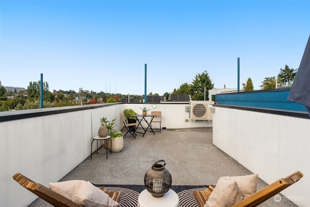 view of patio featuring a balcony and ac unit