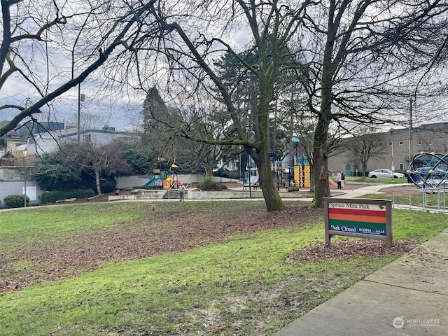 view of property's community featuring a playground and a yard