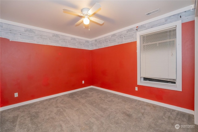 empty room with carpet flooring and ceiling fan