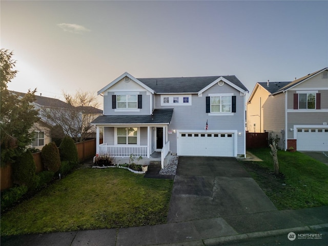 front facade with a lawn, a porch, and a garage