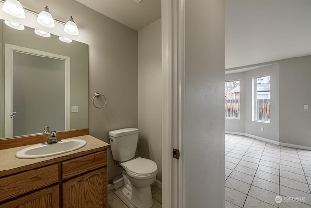 bathroom with tile patterned floors, vanity, and toilet