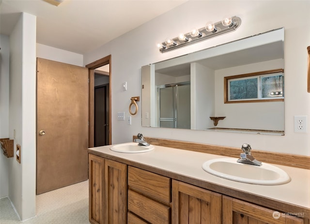 bathroom with vanity and an enclosed shower