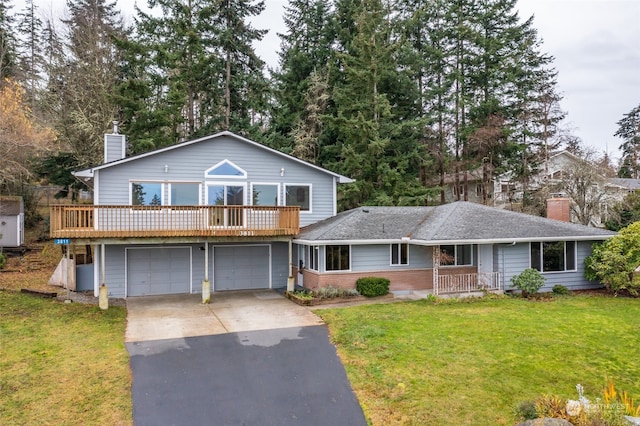 view of front of house with a garage and a front yard