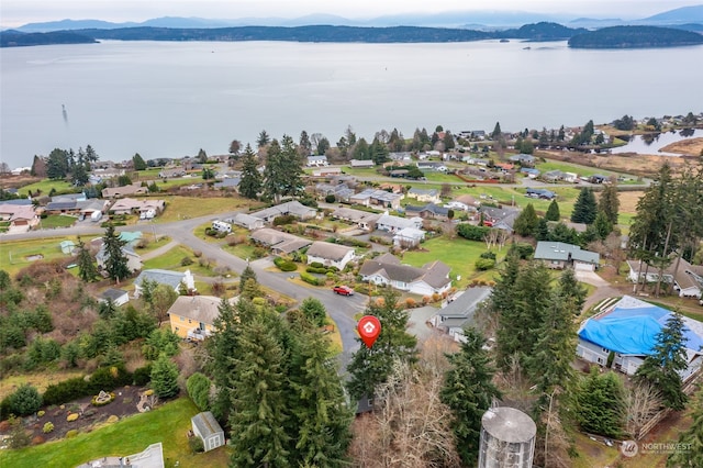 bird's eye view featuring a water and mountain view