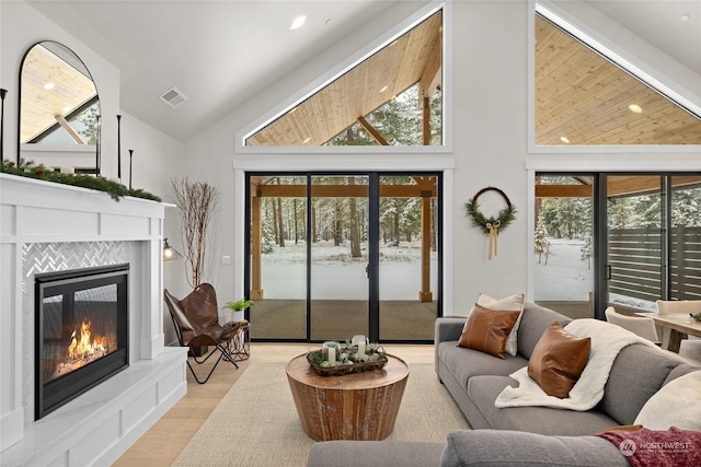 71 Plateau Loop, Cle Elum, WA 98922 - living room with high vaulted ceiling, a fireplace, light wood-style flooring, plenty of natural light, and recessed lighting