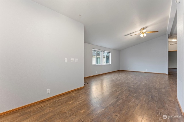 spare room with ceiling fan, dark hardwood / wood-style flooring, and vaulted ceiling