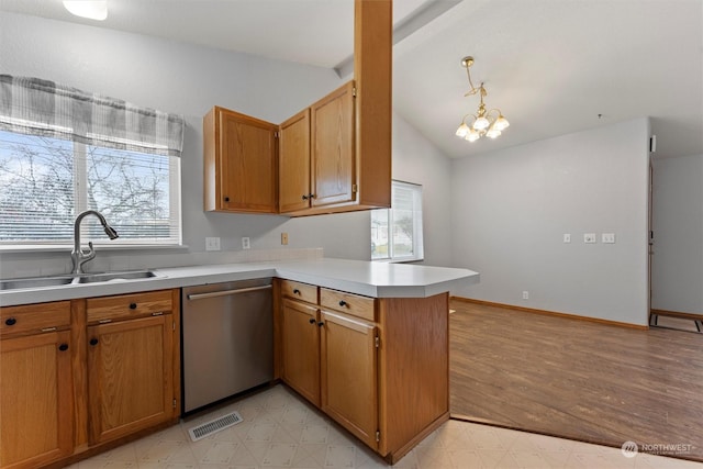 kitchen with dishwasher, sink, decorative light fixtures, a notable chandelier, and kitchen peninsula