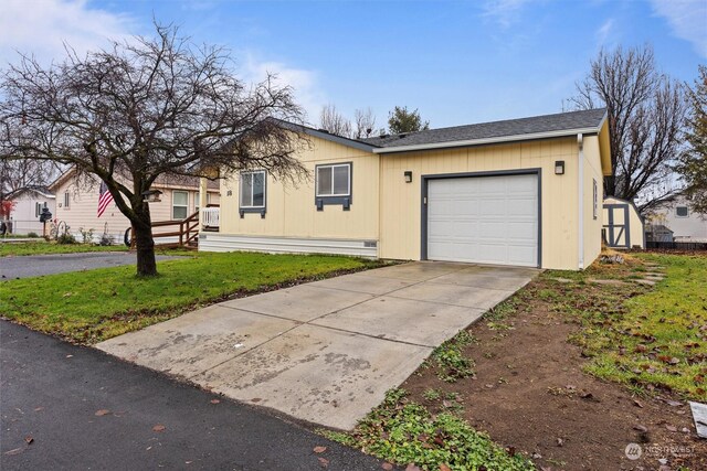 ranch-style house with a front lawn and a garage