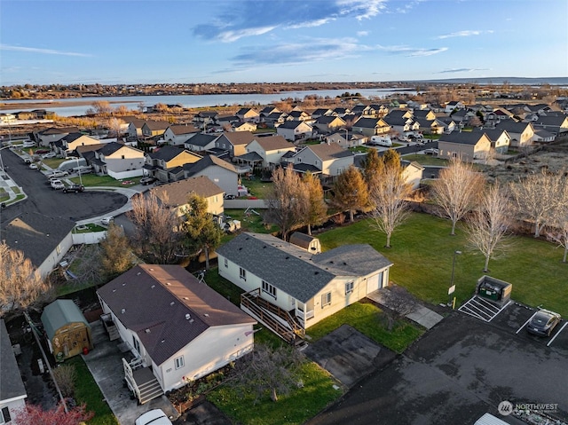 bird's eye view with a water view