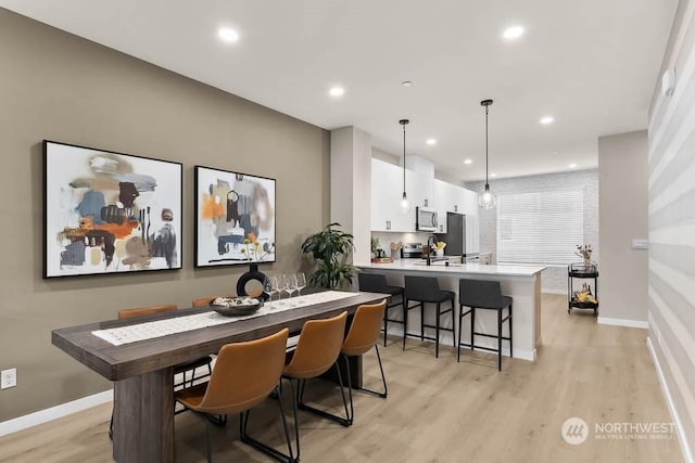 dining room with light hardwood / wood-style floors