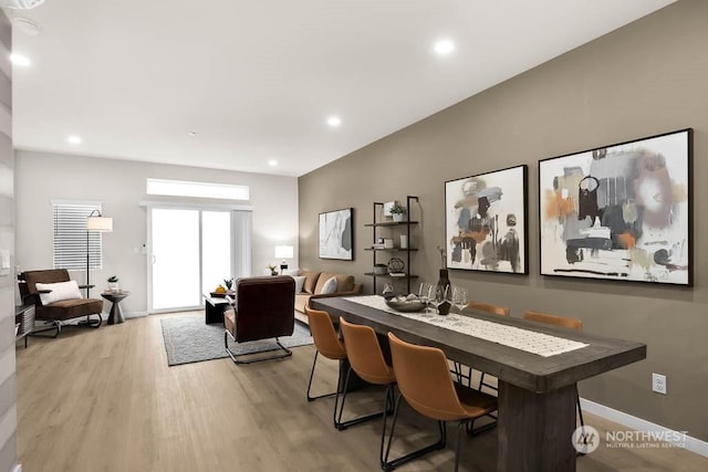 dining area featuring wood-type flooring