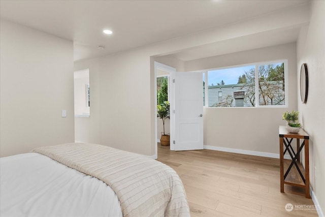 bedroom with light hardwood / wood-style floors