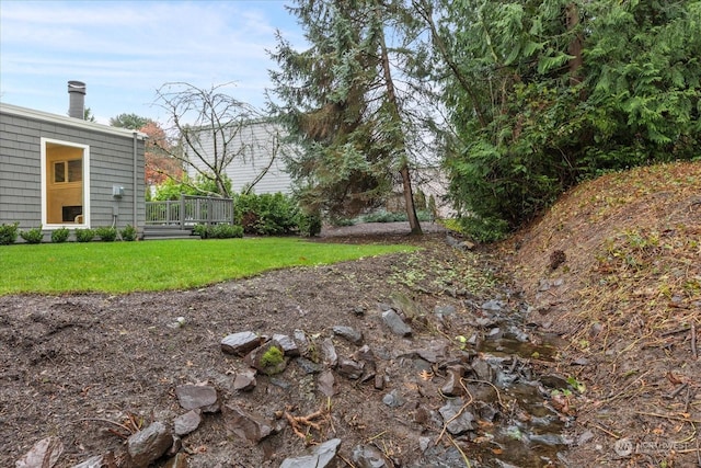 view of yard featuring a wooden deck