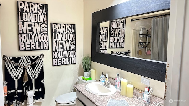 bathroom with vanity and toilet