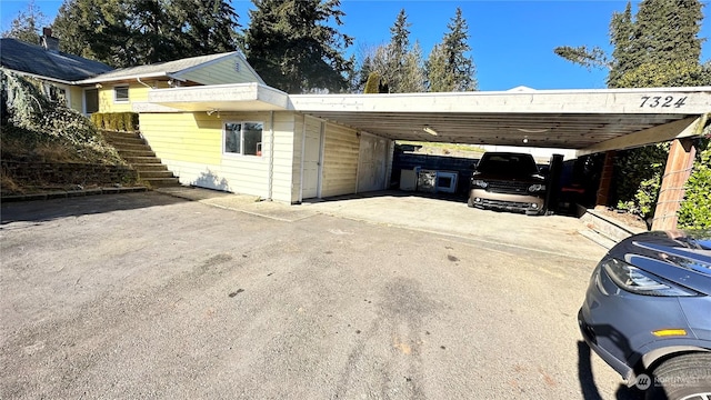 exterior space with a carport