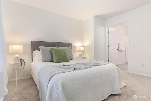 bedroom featuring light carpet