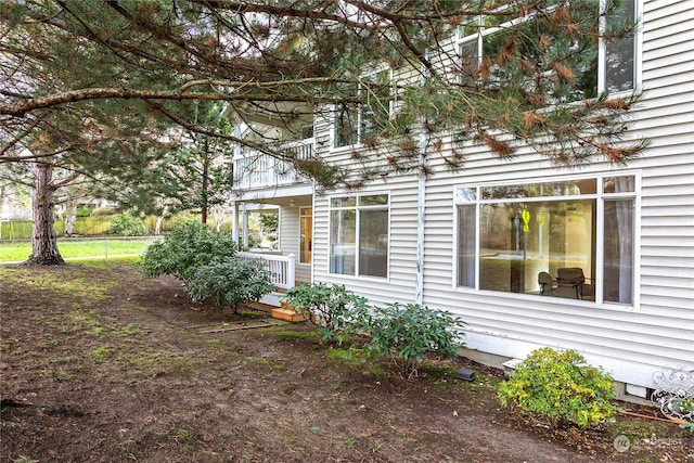 view of property exterior featuring a porch