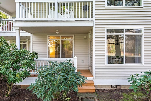 doorway to property featuring a balcony