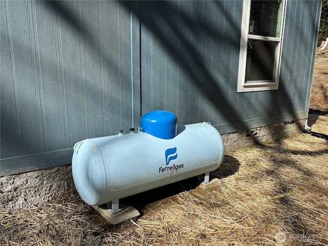 exterior details featuring crawl space and heating fuel