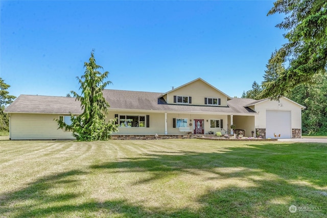 view of front of house featuring a garage and a front lawn