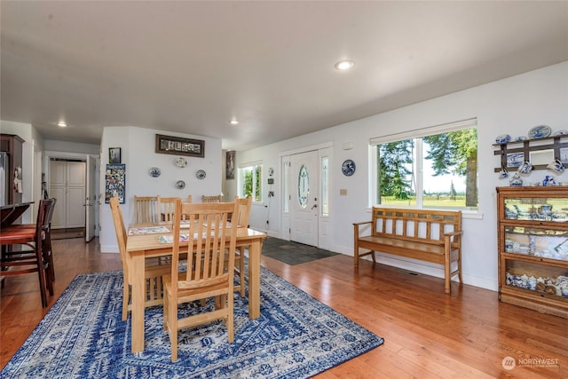 dining space featuring wood-type flooring