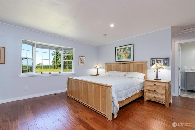 bedroom with dark wood-type flooring