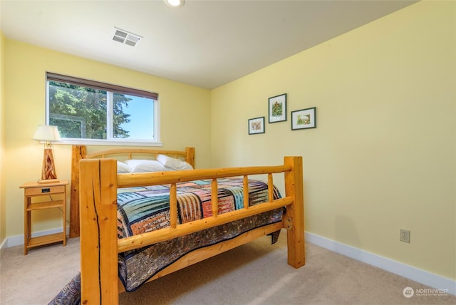 bedroom with light colored carpet