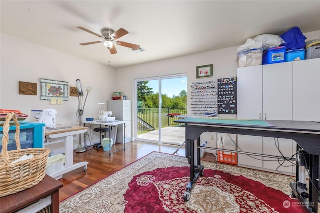 home office featuring dark hardwood / wood-style floors and ceiling fan