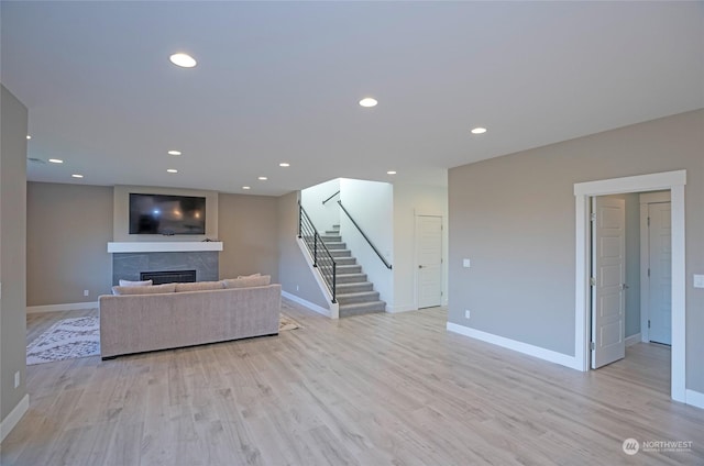 unfurnished living room featuring light hardwood / wood-style floors