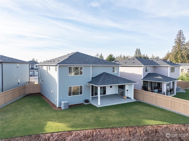 back of property featuring a patio, a yard, and central AC unit