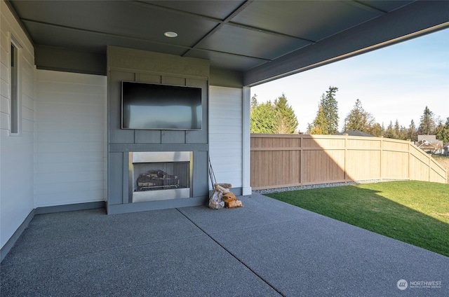 view of patio with a large fireplace