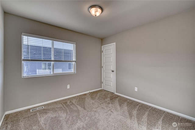 unfurnished room with carpet floors