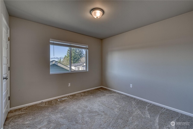 unfurnished room featuring carpet flooring