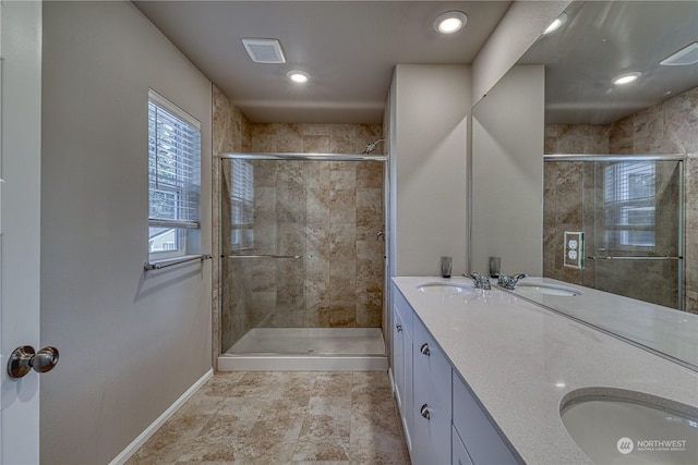 bathroom featuring vanity and walk in shower