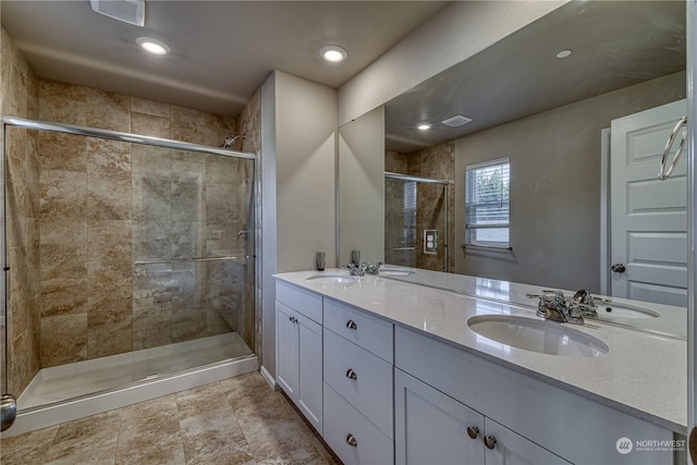 bathroom with vanity and an enclosed shower