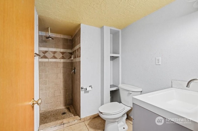 319 4th Ave, Mabton, WA 98935 - bathroom featuring tile patterned floors, a textured ceiling, vanity, and a tile shower