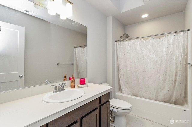 full bathroom with tile patterned flooring, vanity, toilet, and shower / tub combo