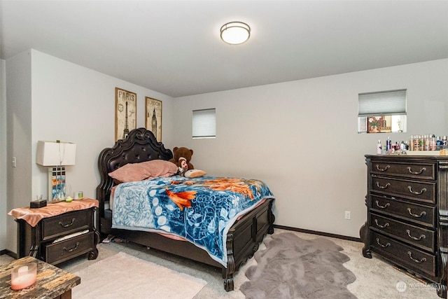 bedroom featuring light carpet