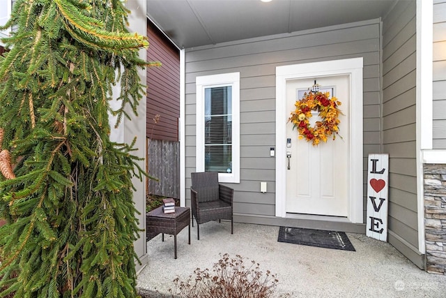 view of exterior entry featuring a porch