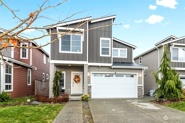 view of front of property featuring central AC unit and a garage