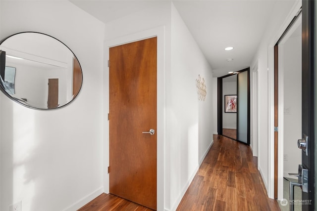 hallway with wood-type flooring