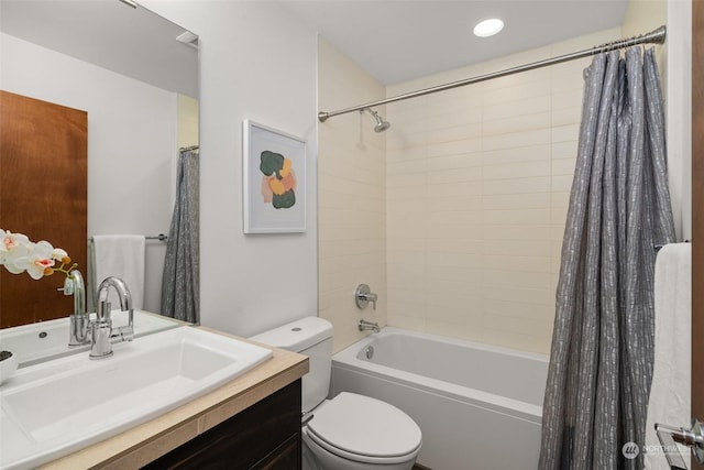 full bathroom featuring vanity, toilet, and shower / tub combo