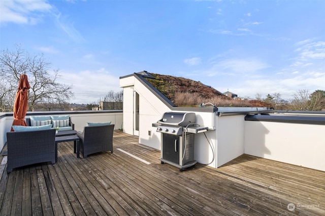 deck with outdoor lounge area and grilling area