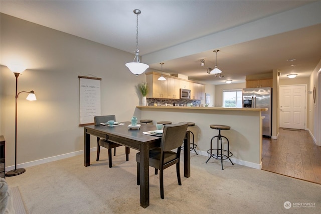 dining room featuring light hardwood / wood-style flooring