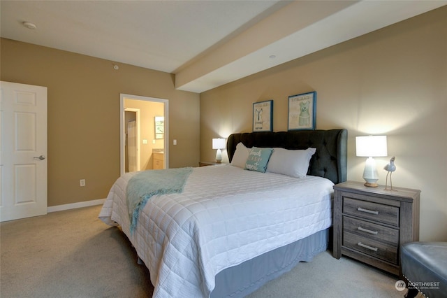 carpeted bedroom featuring connected bathroom