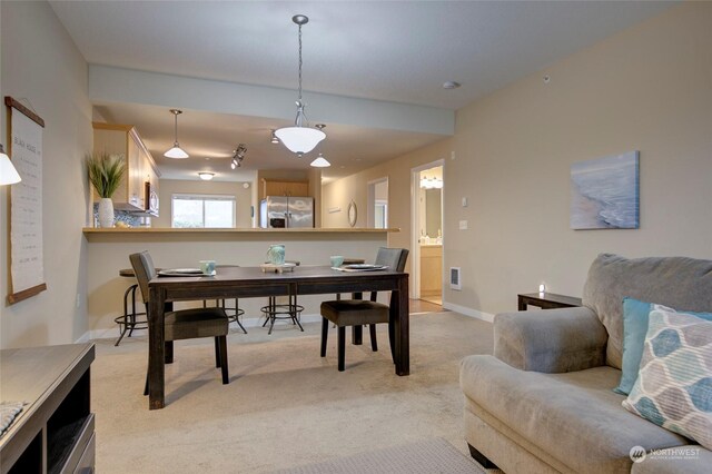 dining area with light carpet