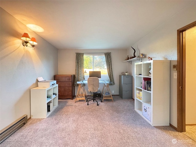 carpeted home office featuring a baseboard heating unit