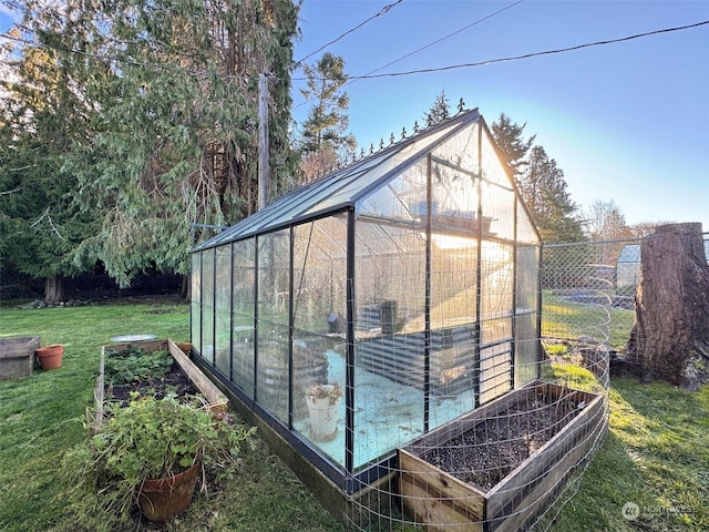 view of outdoor structure featuring a lawn